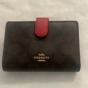 Coach Wallet. Brown with Red Interior. Used, Good condition!